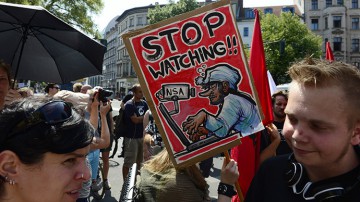 Demonstrators take part
            in a protest against the US National Security Agency (NSA)
            collecting German emails, online chats and phone calls and
            sharing some of it with the country's intelligence services
            in Berlin on July 27, 2013. (AFP Photo / John Macdougall)