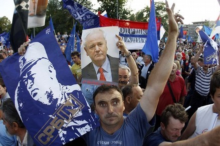 Supporters of Serbian Radical Party holds posters of Milosevic and Mladic during a protest against the arrest of Mladic in Belgrade