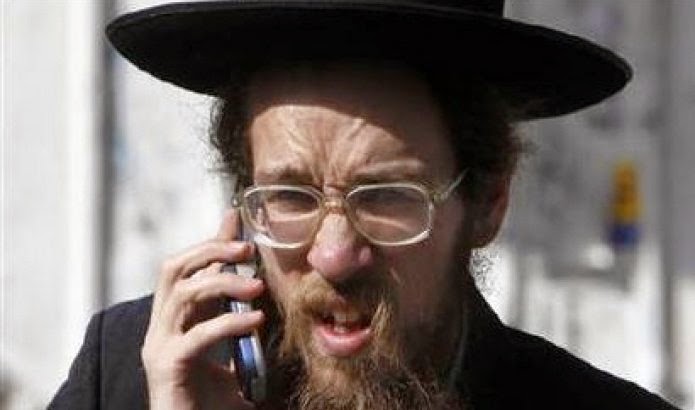 400_300_an_ultra_orthodox_jewish_man_speaks_on_his_cellular_phone_along_