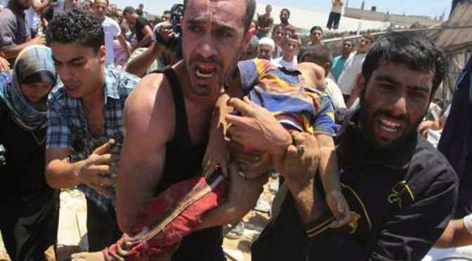gaza-carrying-dead-palestinian-child-killed-by-jewish-airstrike-on-his-home-9-july-2014-reuters